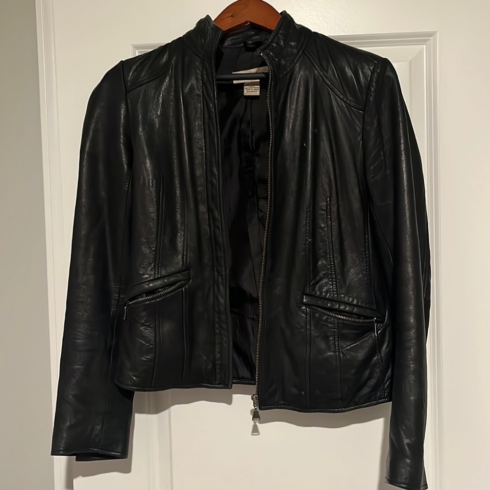 lamb leather (soft). Silky inner lining. Fits very well. ‘Moto’ looking jacket.